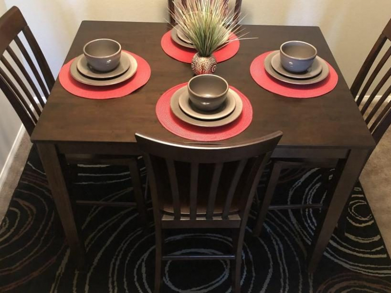 Table with 4 chairs made of wood